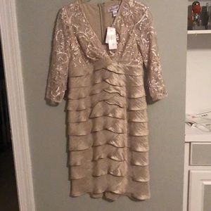 Gold scalloped, layered dress.